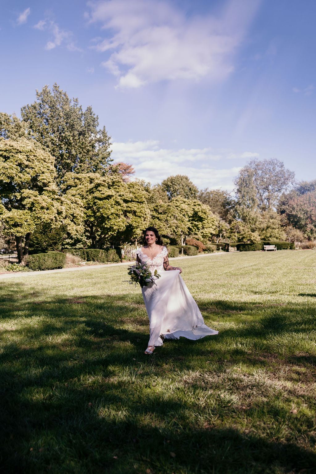 Bride and Groom celebrating after their wedding on the lawn of Ault Park in Mt. Lookout 
