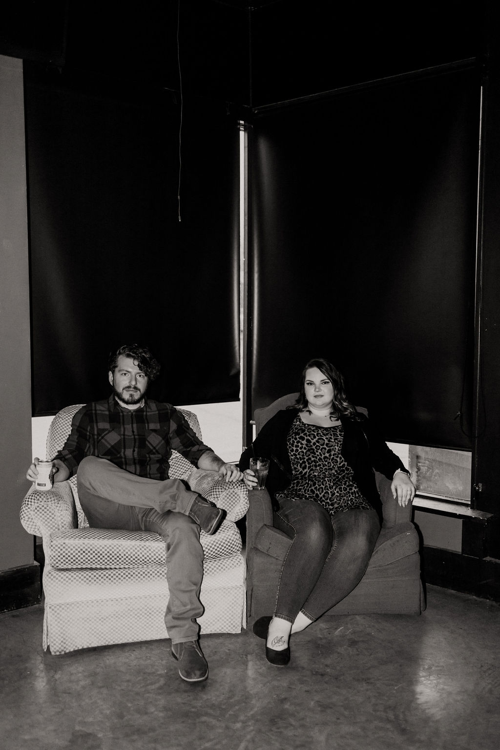 engaged couple during engagement session at arcade bar in northside outside of downtown cincinnati, ohio