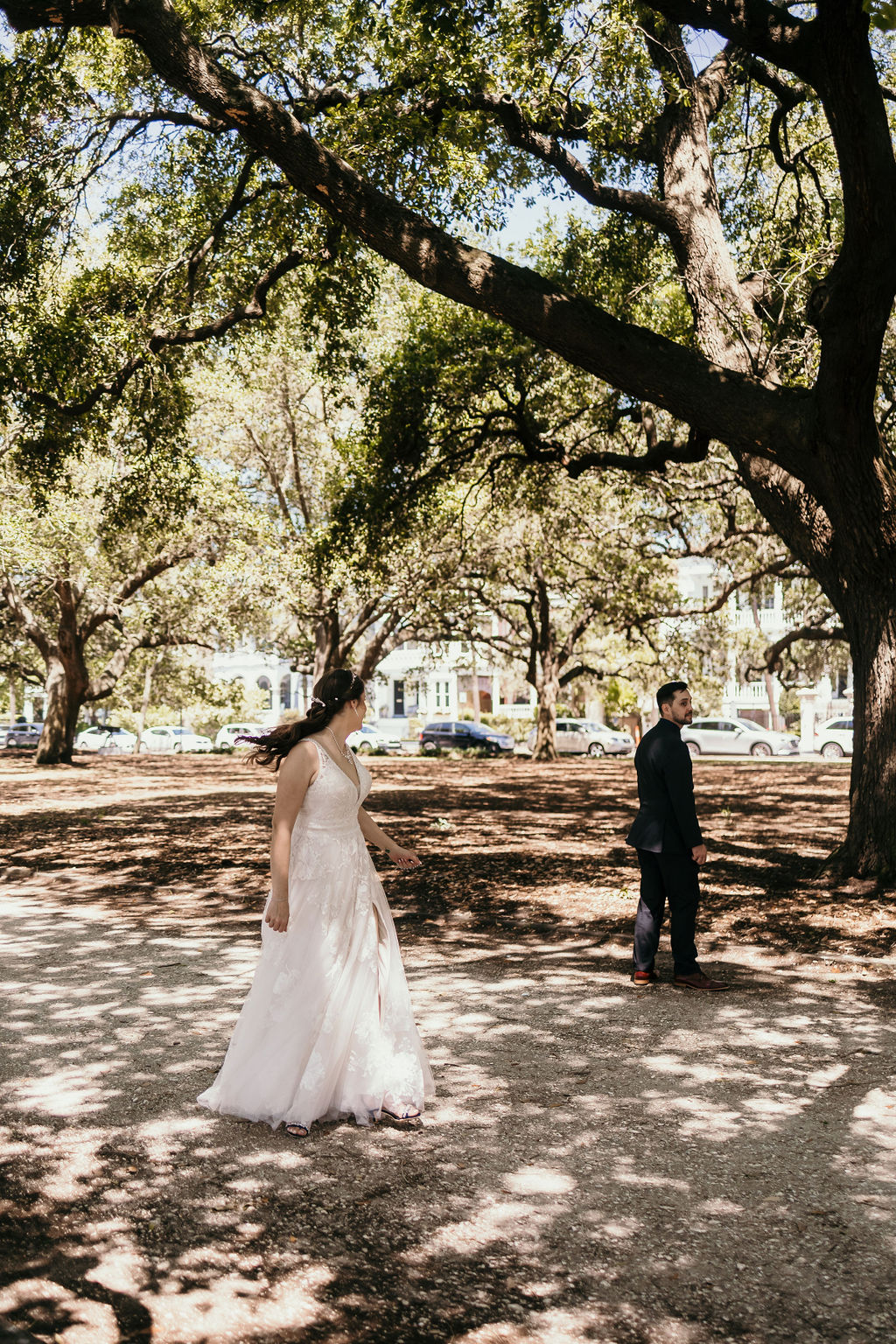 first look in downtown charleston, sc with couple getting married at white point garden