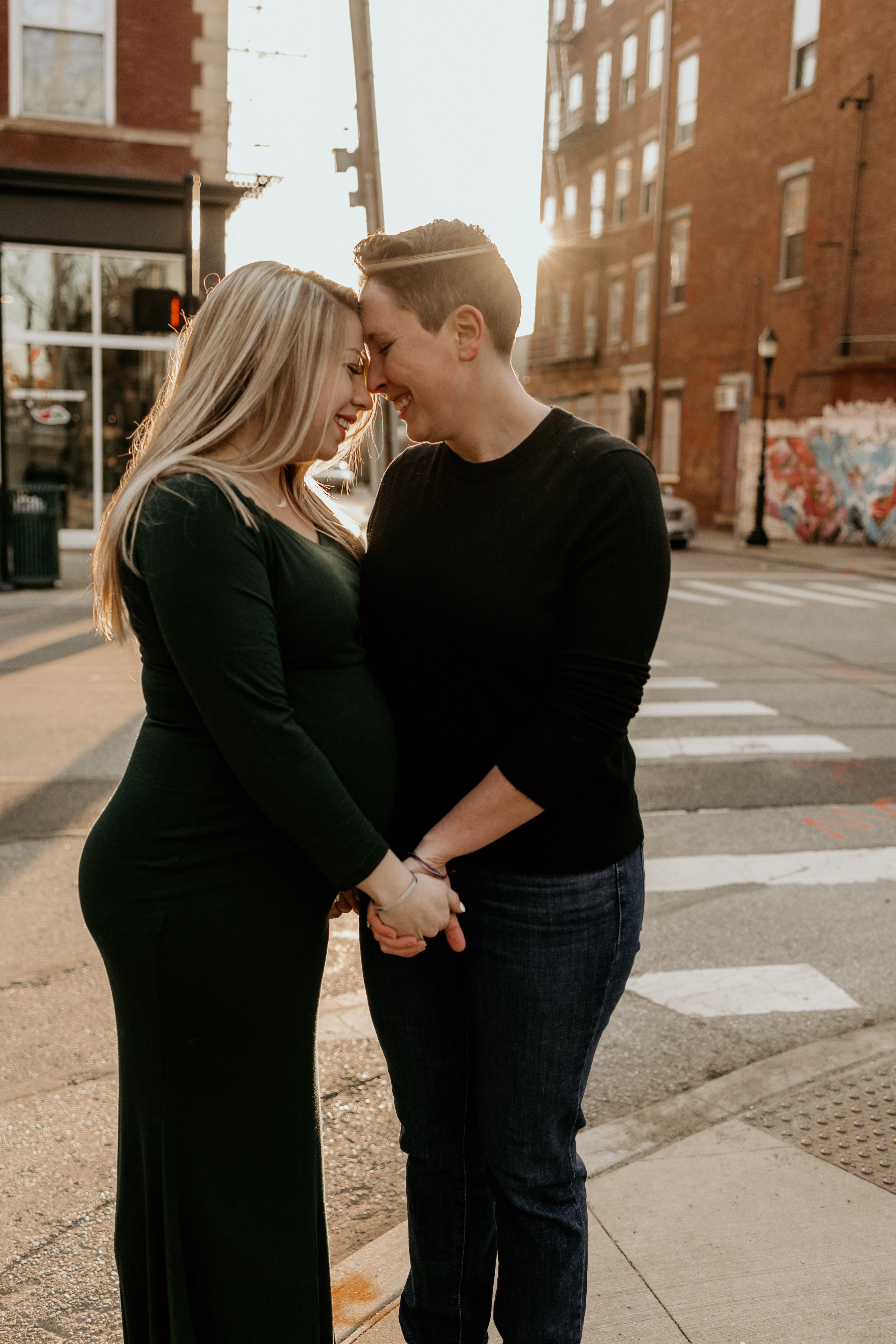 lesbian couple during maternity photoshoot in downtown Cincinnati OH.