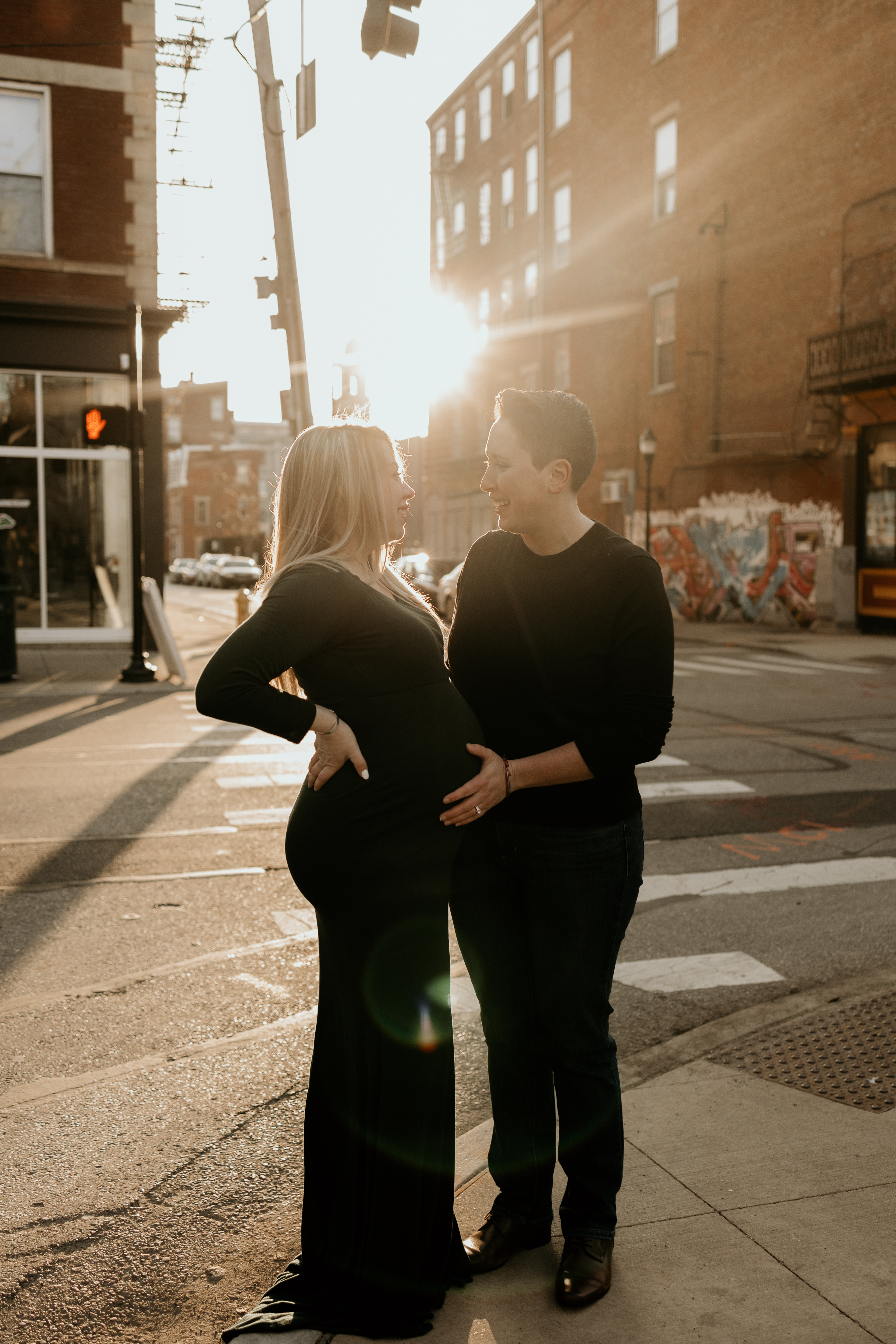 lesbian couple during maternity photoshoot in downtown Cincinnati OH.